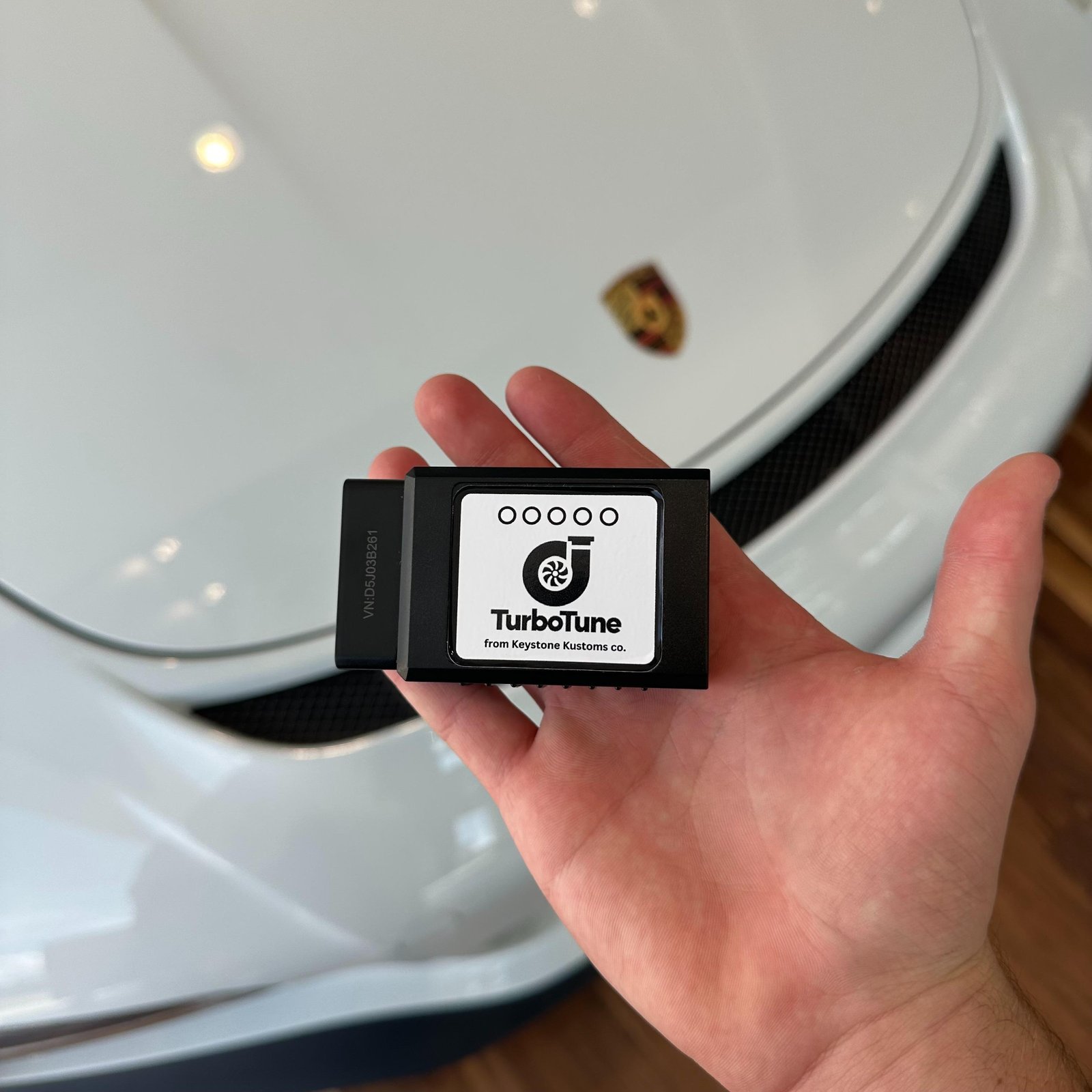 TurboTune device in front of a Porsche